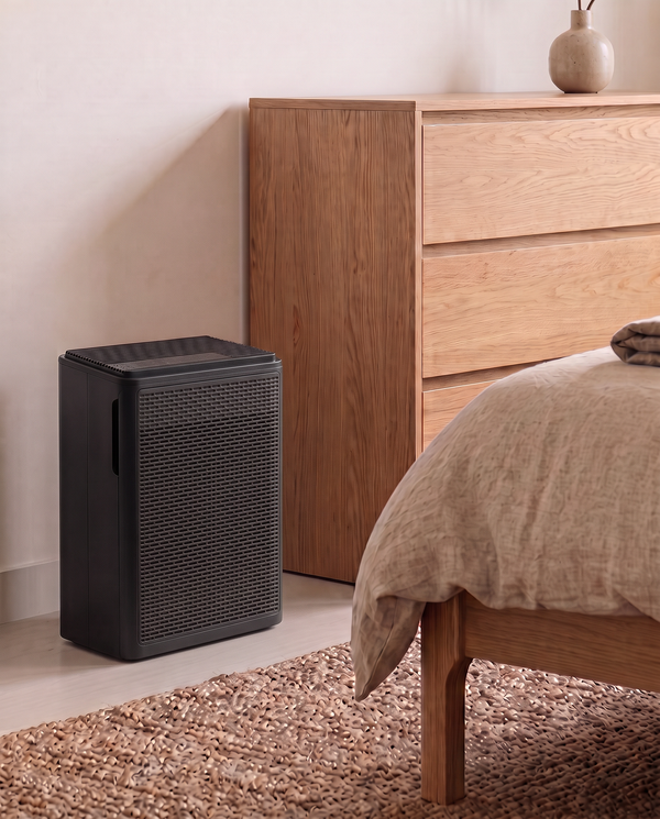 Black Von air purifier in a bedroom